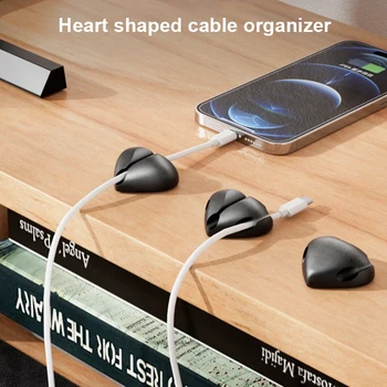 Тенис на силикон Органайзер за навиване на кабела във формата на сърце с 3 дупки, скоба за управление на проводниците, място за съхранение на USB кабела на мишката, кабел, слушалки